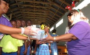 we-care-charitable-foundation-passing-out-supplies-grand-boulage-haiti